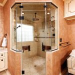 traditional bathroom steam shower wood cubicle doors orange wall paint crown molding faux finish glass