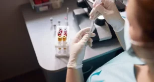 female lab tech takes sample from test tube to res 2022 01 19 00 01 33 utc 880x587.jpg